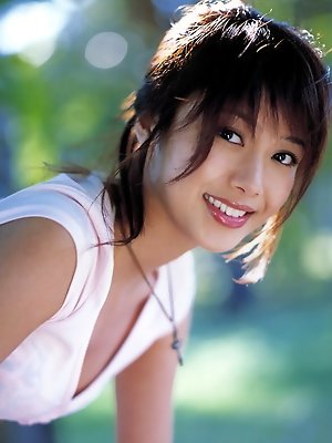 Seductive asian temptress in a short blue jean skirt and tshirt